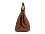 a brown handbag on a white background