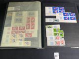 a lot of stamps on the table and a book