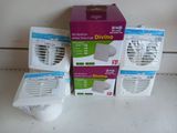 three boxes of air conditioners sitting on top of a white counter