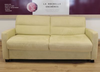 a couch that is sitting in front of a wall