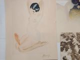 several drawings of a woman sitting on top of a white table