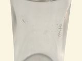 a clear glass bottle with a wooden stopper on it