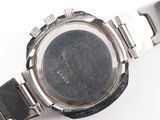 an image of a close up of a wrist watch on a white surface