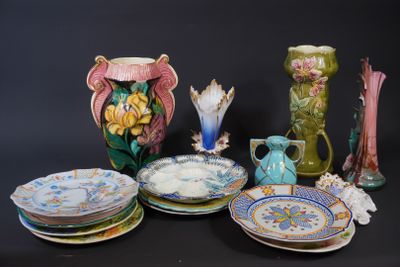 many plates and vases that are sitting on a table