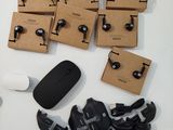 a lot of headphones and a mouse on a table