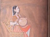 a painting of a woman sitting on a chair playing a musical instrument