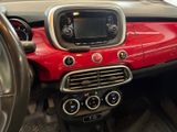 a red and black car dashboard with a steering wheel and dashboard controls