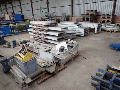 a large warehouse with a lot of metal items in it