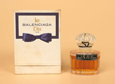 an image of a bottle of balenciaia dix perfume next to a box
