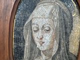 a painting of a woman with a veil on her head