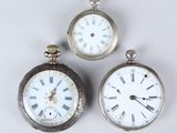 three different sized pocket watches with roman numerals and roman numerals