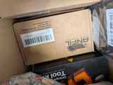 a box full of assorted items sitting on the floor