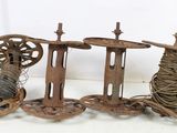 three spools and a spool of thread on a table
