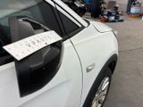 a car that has a parking ticket on the side of it