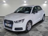 an image of a white audi car in a showroom