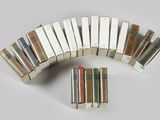 several books are stacked on top of each other on a table