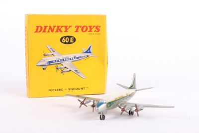 a toy airplane that is sitting next to a box