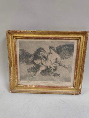 une image représentant un tableau d'un ange et d'une femme dans un cadre doré