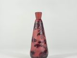 an image of a red glass vase with a floral design on it
