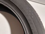 a close up of a tire on a white surface