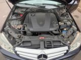 a car with the hood open and the engine in the trunk