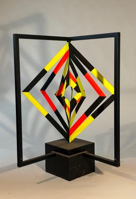 a sculpture made out of paper with a geometric design on it
