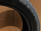 tires are stacked on top of a cardboard box in front of a cardboard box