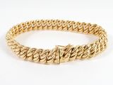 a yellow gold bracelet with a braid design