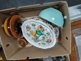 a box full of plates and bowls sitting on a table