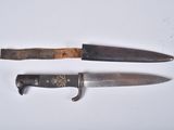 two knives are sitting next to each other on a white surface