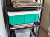 a shelf that has a lot of boxes on top of it