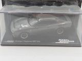 a toy car in a plastic box on a table