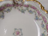 a close up of a plate with flowers on it