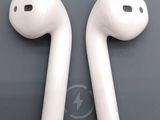 two white airpods sitting next to each other on top of a table
