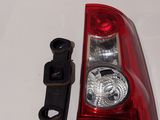 a close up of a red tail light and a black latch