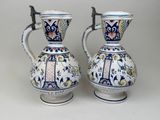 two vases that are sitting on a table