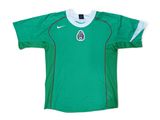 a green soccer jersey with a white collar and a black and white logo