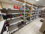 many shelves of soda and soda drinks in a store