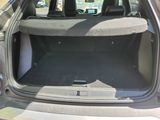 the back of a car with the trunk open and the seats down