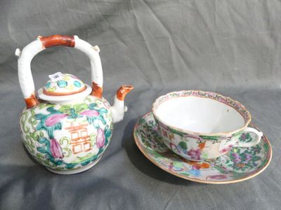 a tea pot and a cup on a table