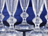 a lot of empty wine glasses sitting on a table