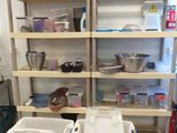 a kitchen with a lot of shelves and bins on the floor
