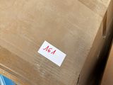a cardboard box sitting on top of a window sill
