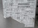 a close up of a metal box with a sticker on it