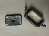 two old cell phones that are on a table