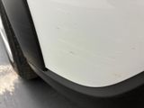 a close up of a car door handle with a sticker on it