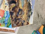 a picture of a painting on a table next to books
