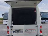 a white van that is parked in a parking lot
