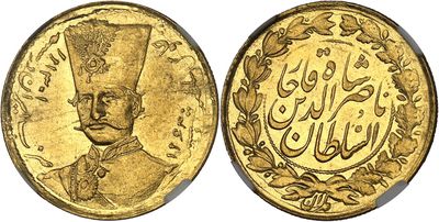 a close up of two gold coins with arabic writing on them