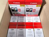 a box of canon ink cartridges sitting on top of a cardboard box